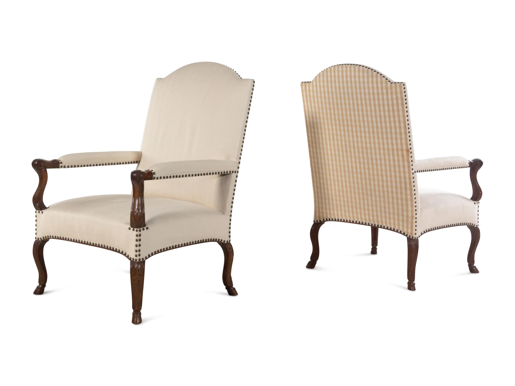 A Set of Four Régence Style Carved Walnut Library Chairs