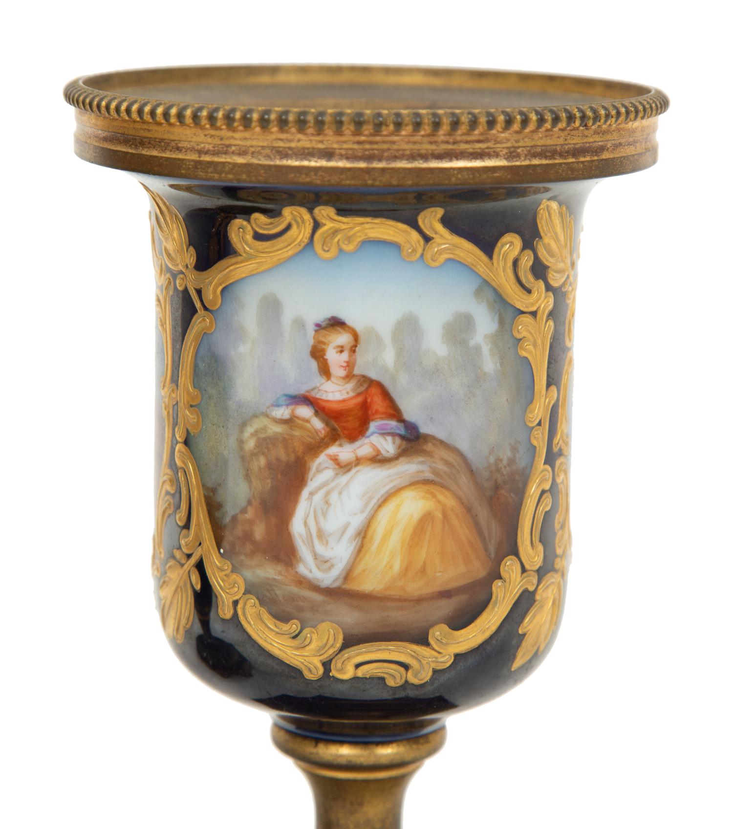 A Pair of Small Sevrés Style Porcelain and Gilt Bronze Urns