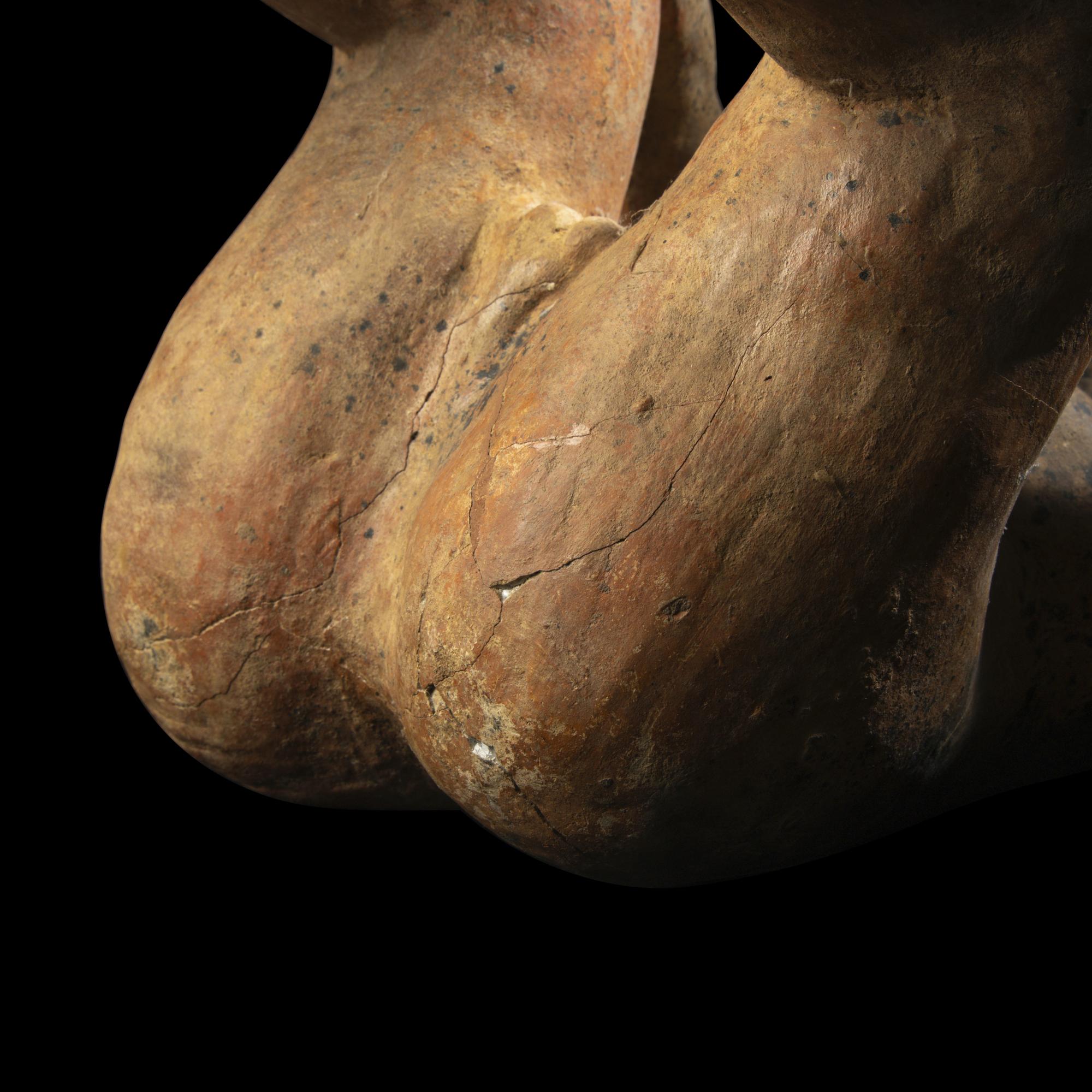 A Jalisco Terracotta Seated Male Figure