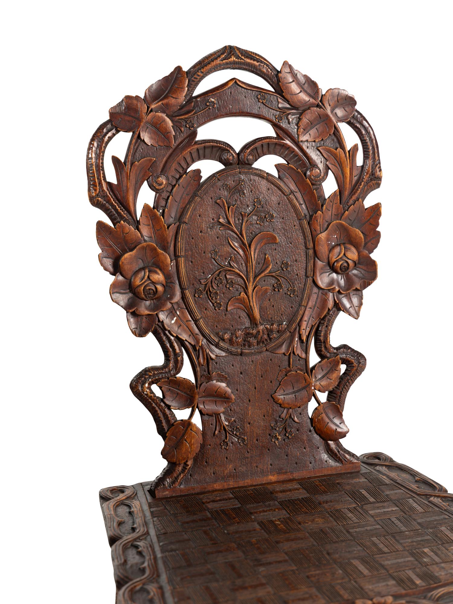 Three Black Forest Carved Side Chairs