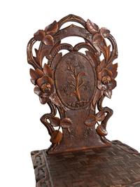 Three Black Forest Carved Side Chairs