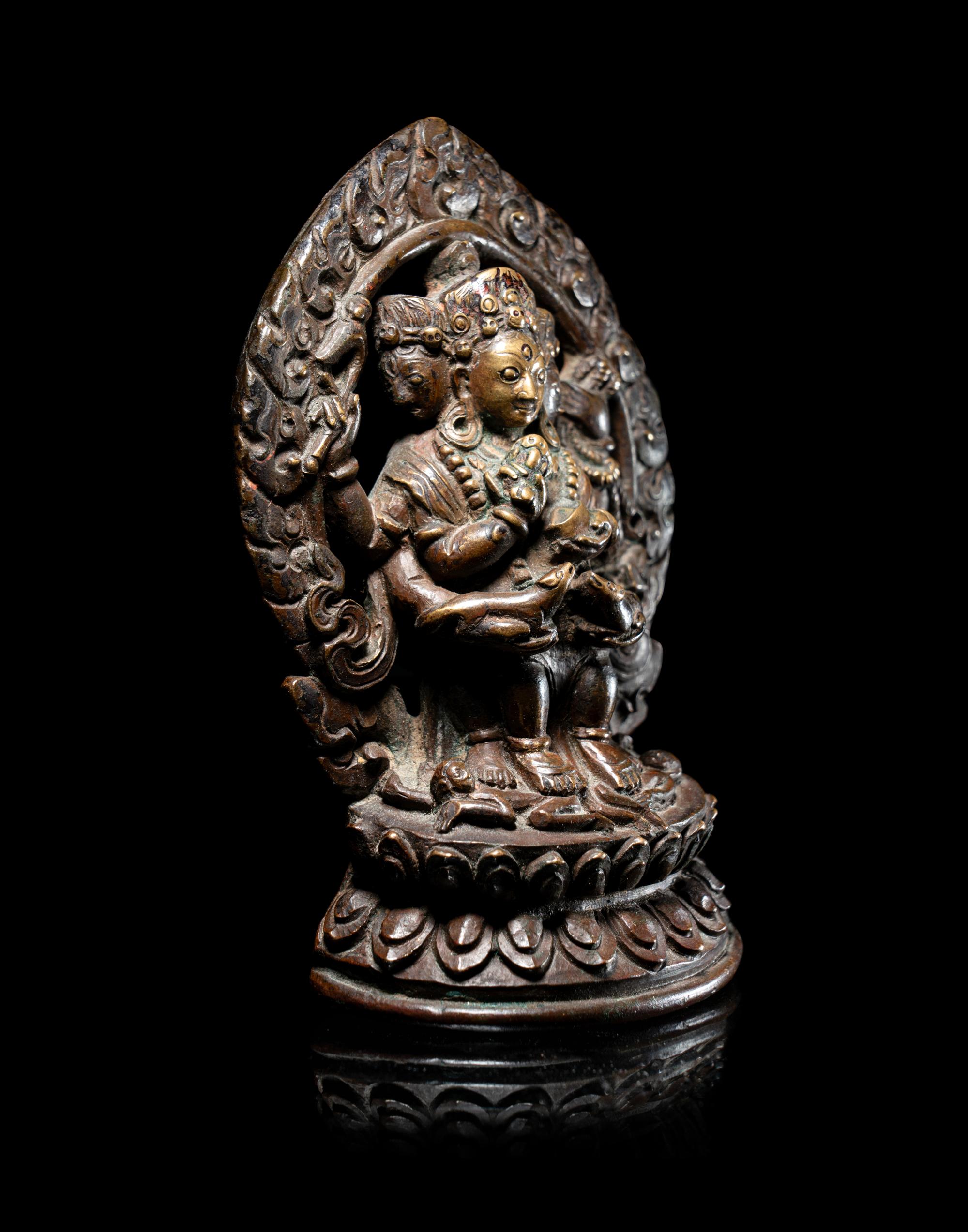 A Rare Tibetan Bronze Figure of Red Jambhala