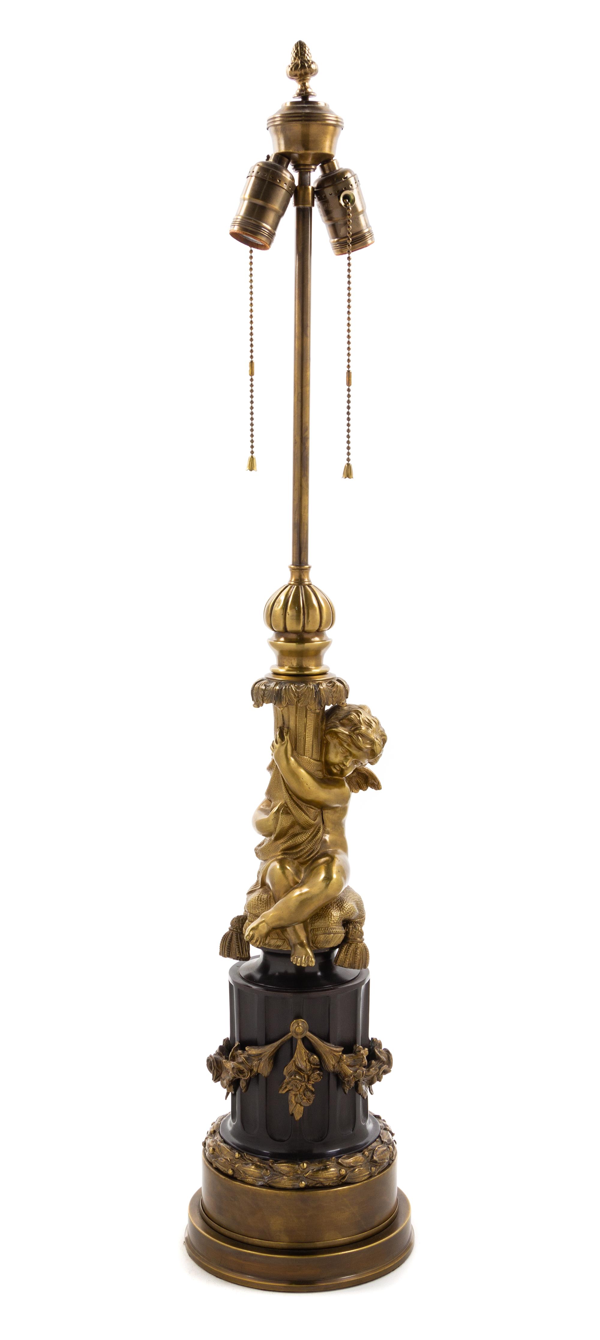 A French Gilt Metal Figural Lamp Height overall 33 inches. — 20TH CENTURY