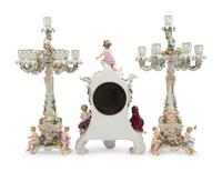 A Meissen Porcelain Clock Garniture and Clock Stand