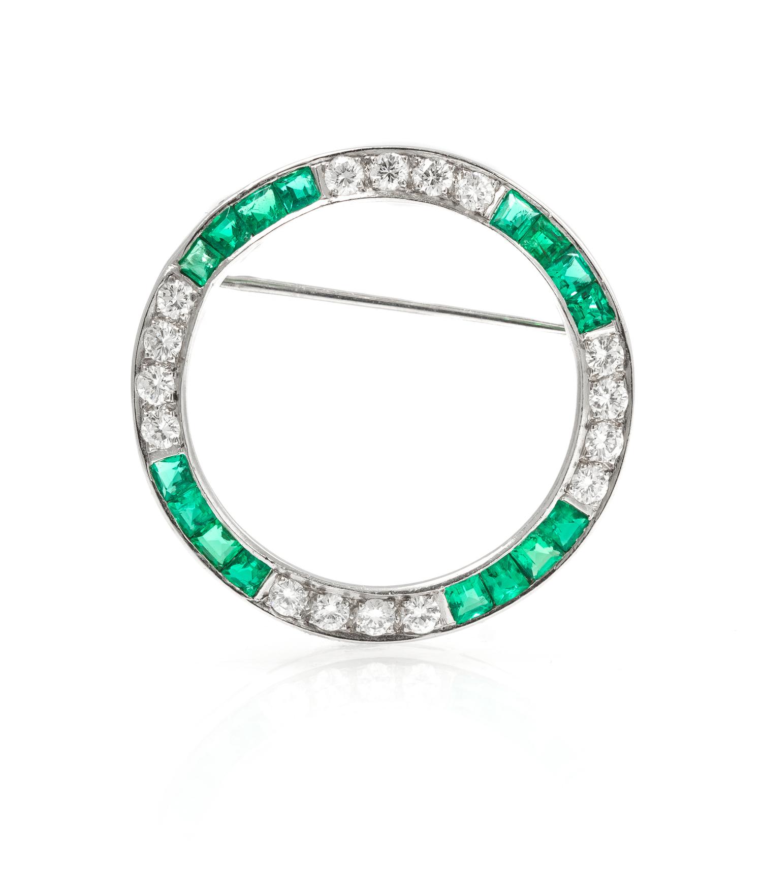 A Platinum, Diamond, and Emerald Circle Brooch, 4.40 dwts.