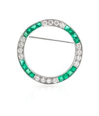A Platinum, Diamond, and Emerald Circle Brooch, 4.40 dwts.