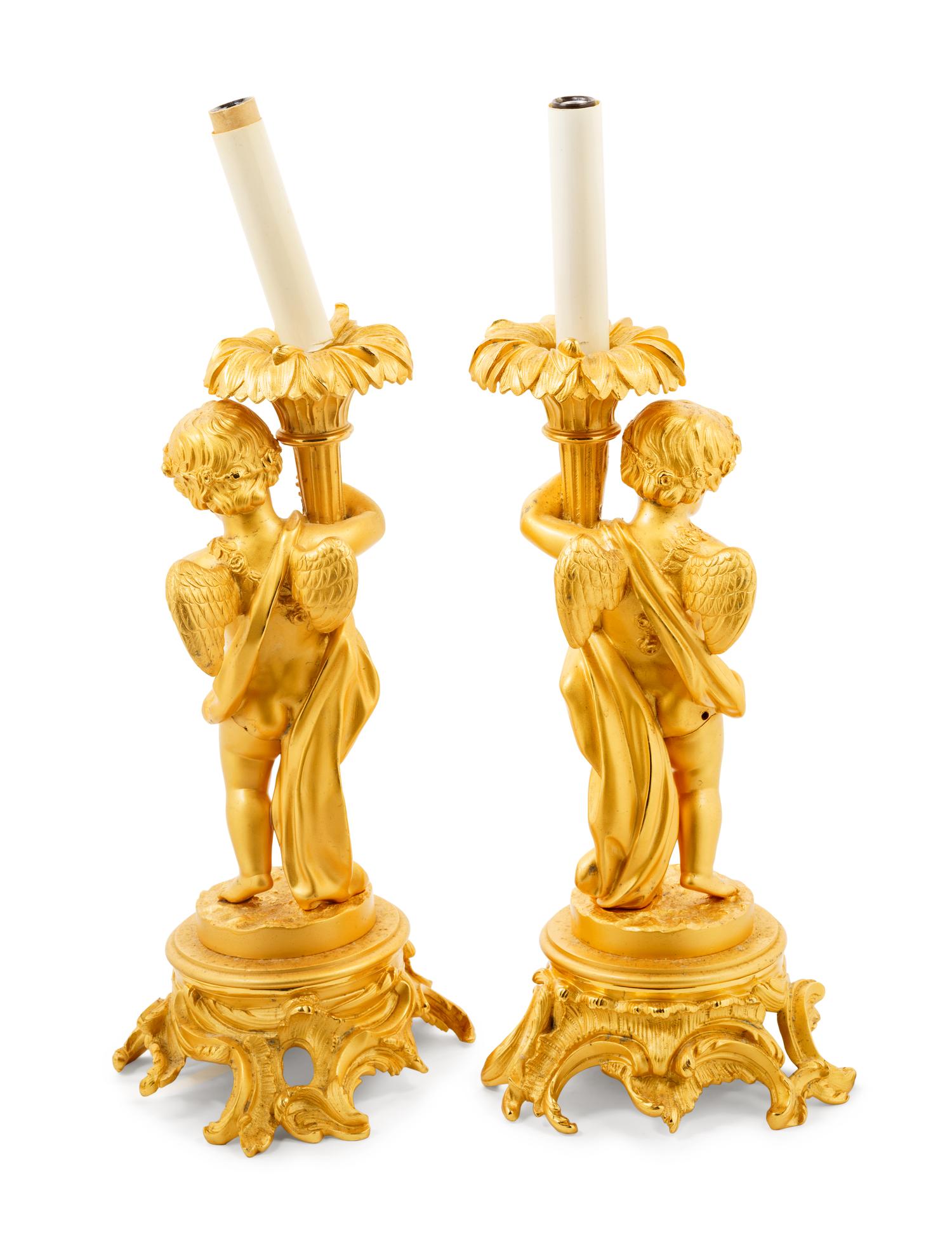 A Pair of Louis XV Style Gilt Bronze Putto Lamps