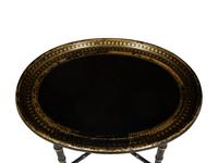 A Regency Style Black and Gilt Decorated Lacquer Tray Top Table
