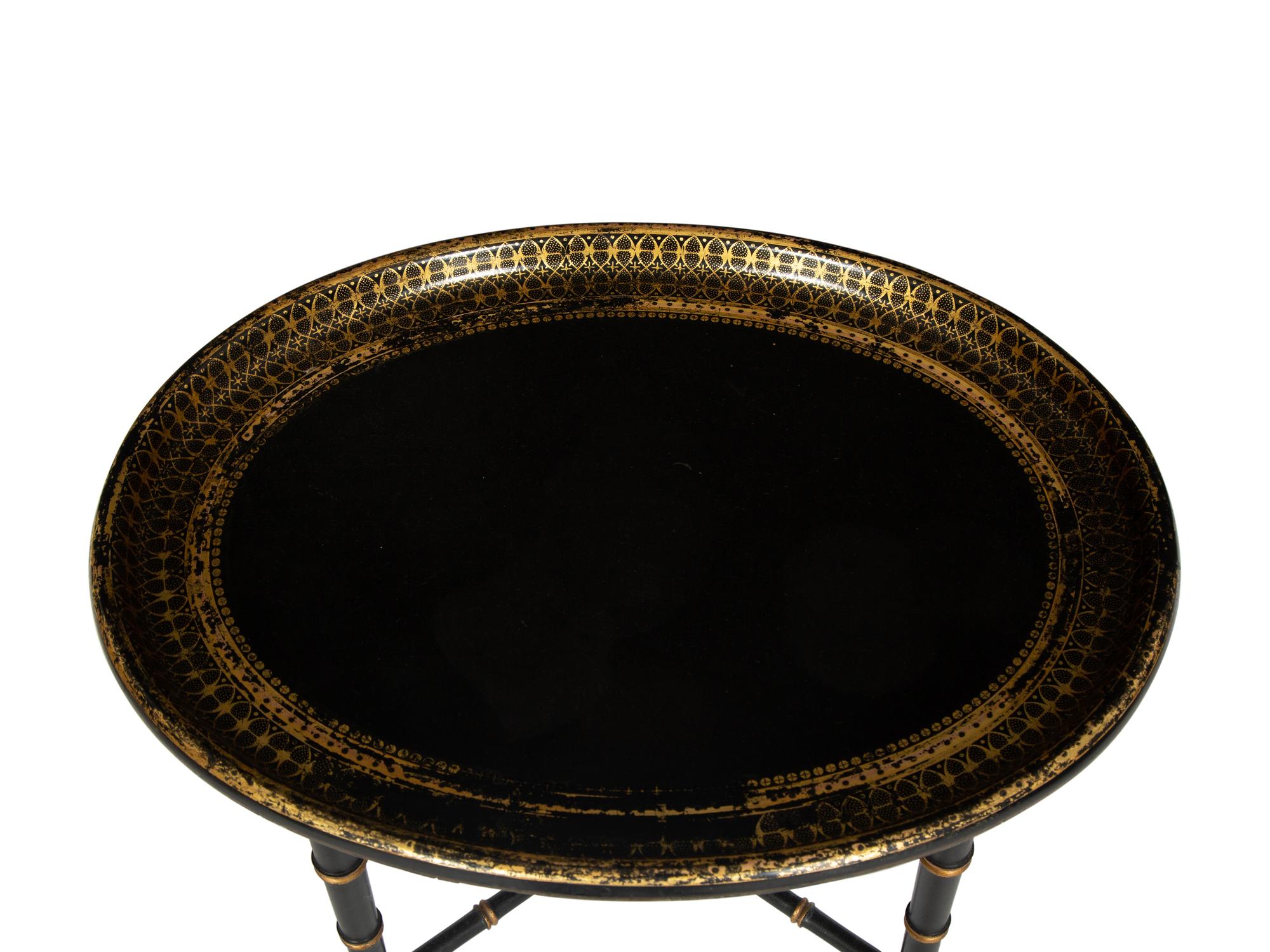 A Regency Style Black and Gilt Decorated Lacquer Tray Top Table