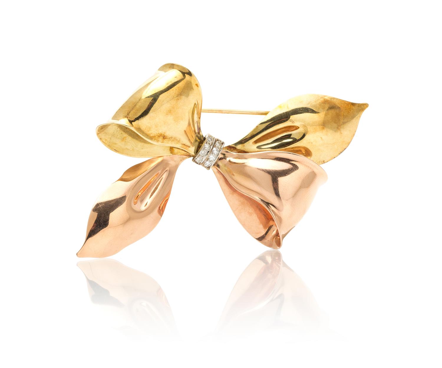 A Retro Gold and Diamond Bow Brooch, 14.80 dwts.