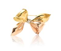 A Retro Gold and Diamond Bow Brooch, 14.80 dwts.