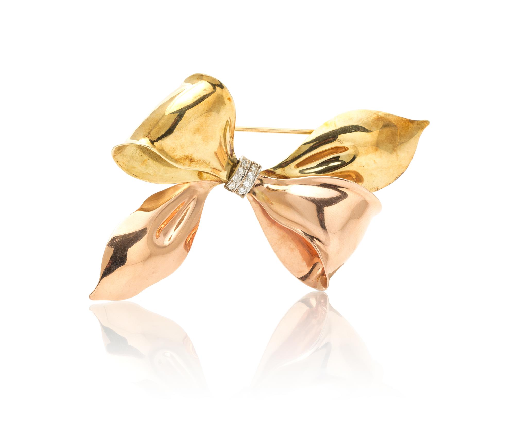 A Retro Gold and Diamond Bow Brooch, 14.80 dwts.
