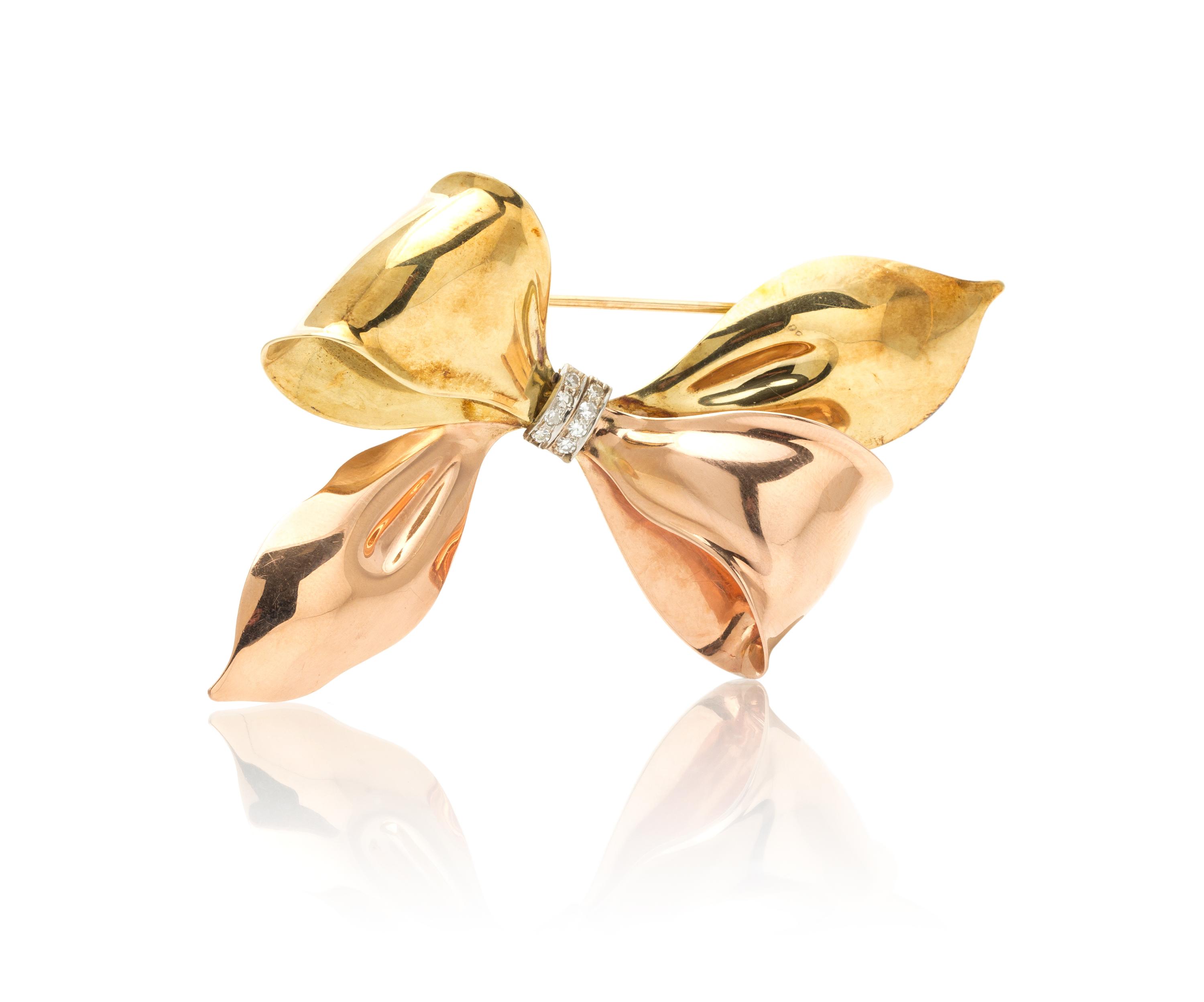 A Retro Gold and Diamond Bow Brooch, 14.80 dwts.
