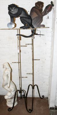 A Pair of Tole Monkey Plaques on Stands. Height 63 inches.