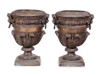 A Pair of Neoclassical Style Cast Metal Urns
