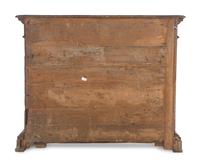 An Italian Baroque Carved Walnut Cabinet