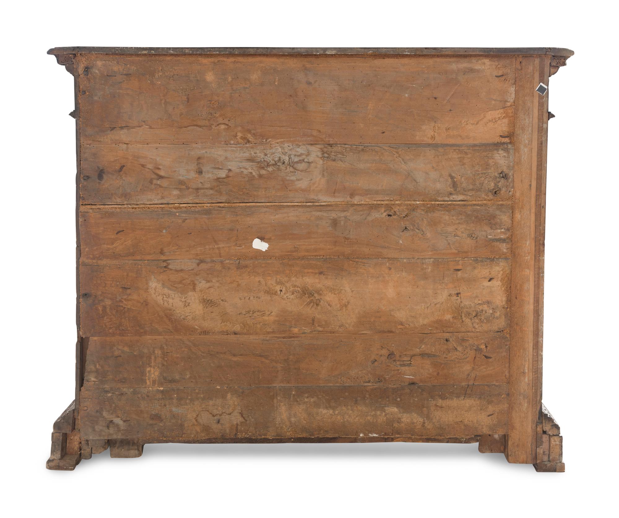 An Italian Baroque Carved Walnut Cabinet
