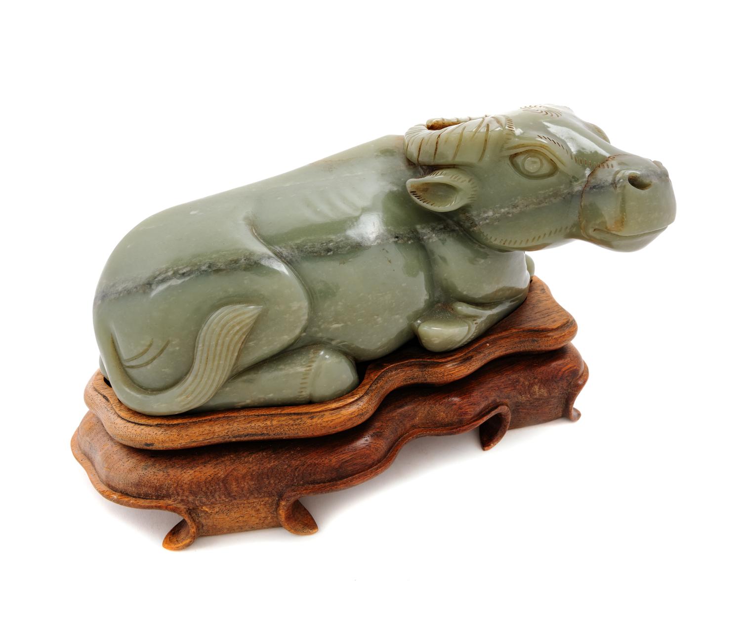 A Chinese Carved Nephrite Jade Model of a Water Buffalo and a Fitted Stand