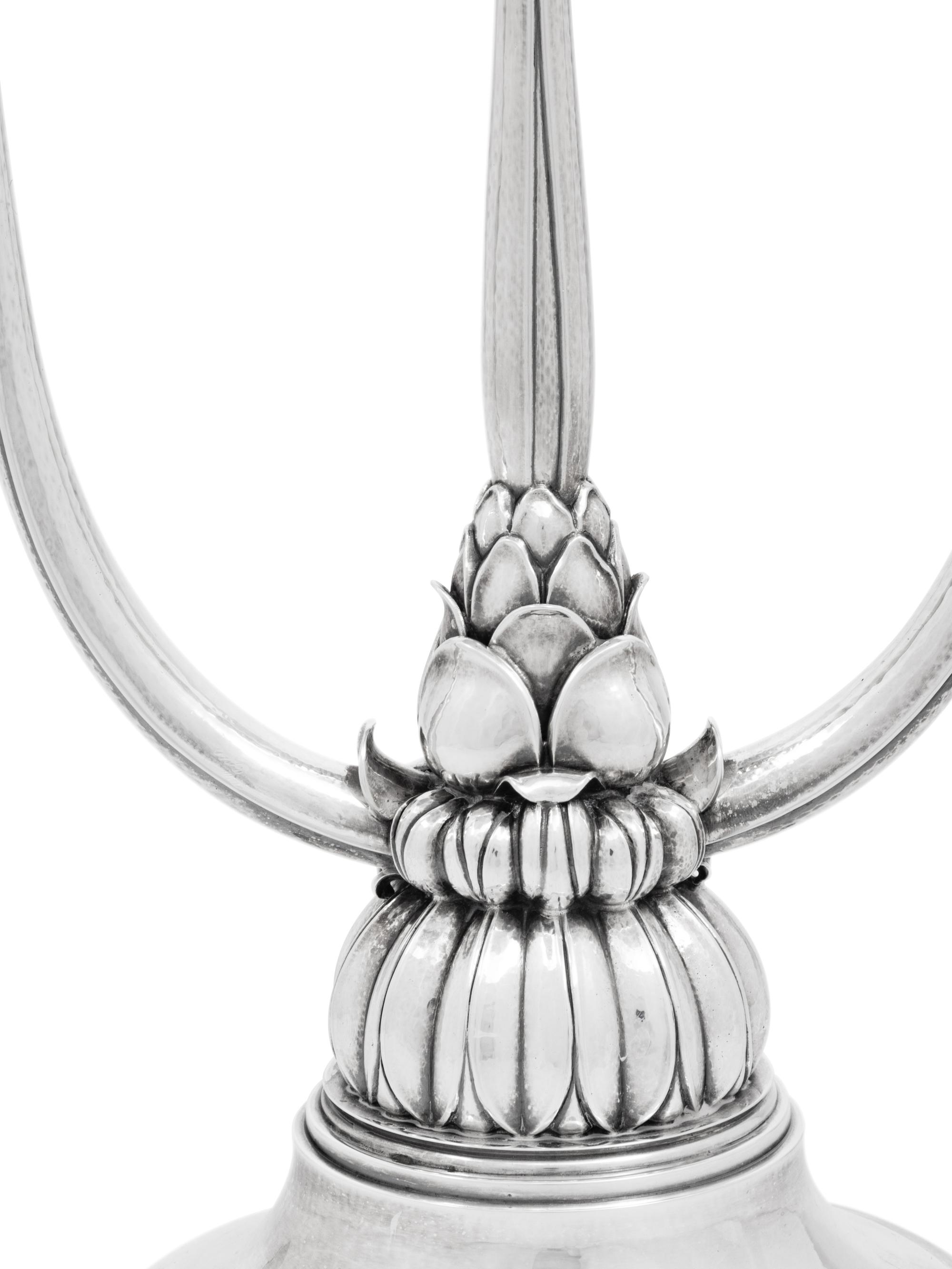 A Pair of Harald Nielsen for Georg Jensen Silver Three-Light Candelabra
