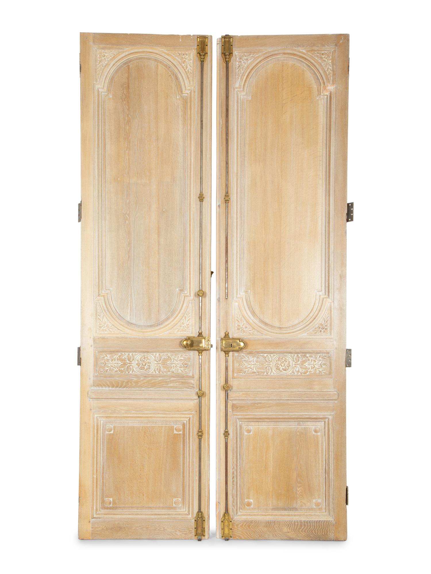 A Pair of French Cerused Oak Doors with Gilt Bronze Fixtures