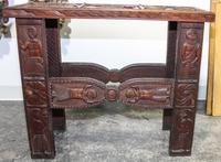 An Ethnographic Side Table. Height 26 1/4 x width 31 x depth 11 3/4 inches.