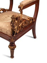 A Pair of Empire Style Parcel Gilt Walnut Armchairs
