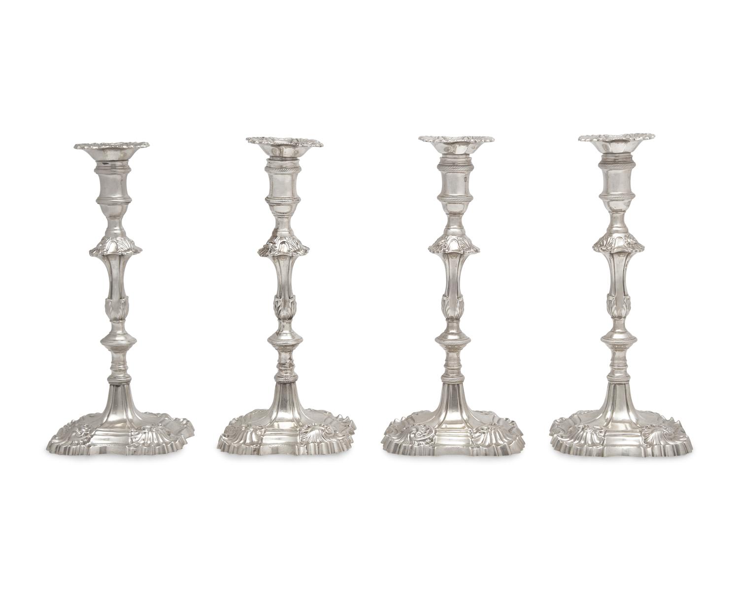 An Assembled Set Of Four George III Sterling Silver Candlesticks