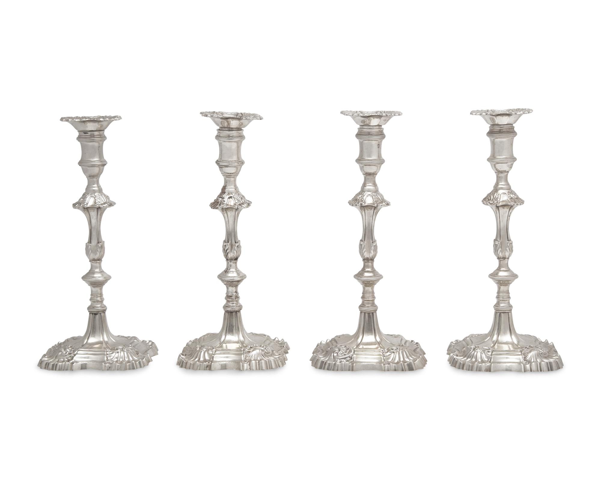 An Assembled Set Of Four George III Sterling Silver Candlesticks