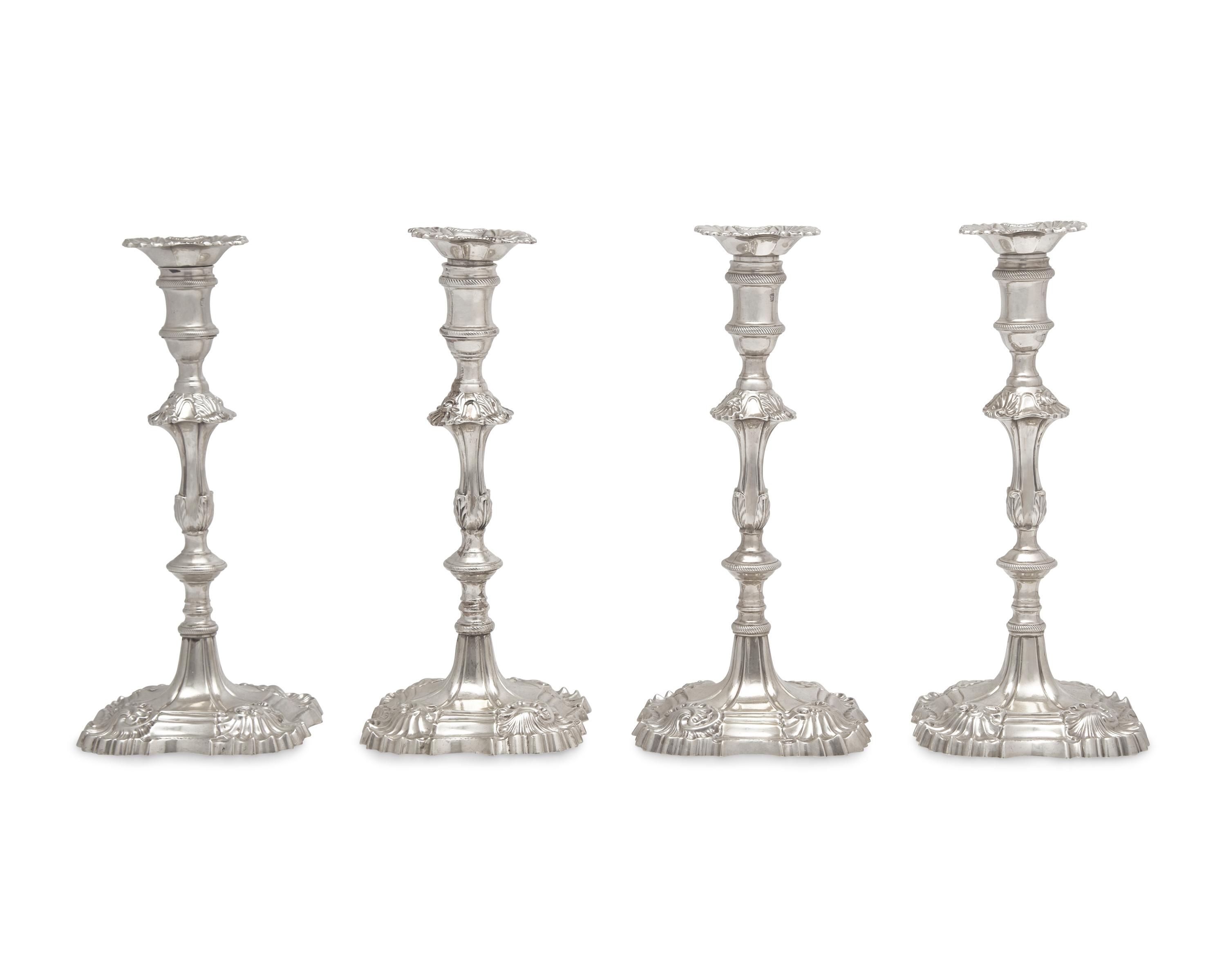 An Assembled Set Of Four George III Sterling Silver Candlesticks