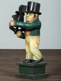 A Carved Wood Figure of a Navigator