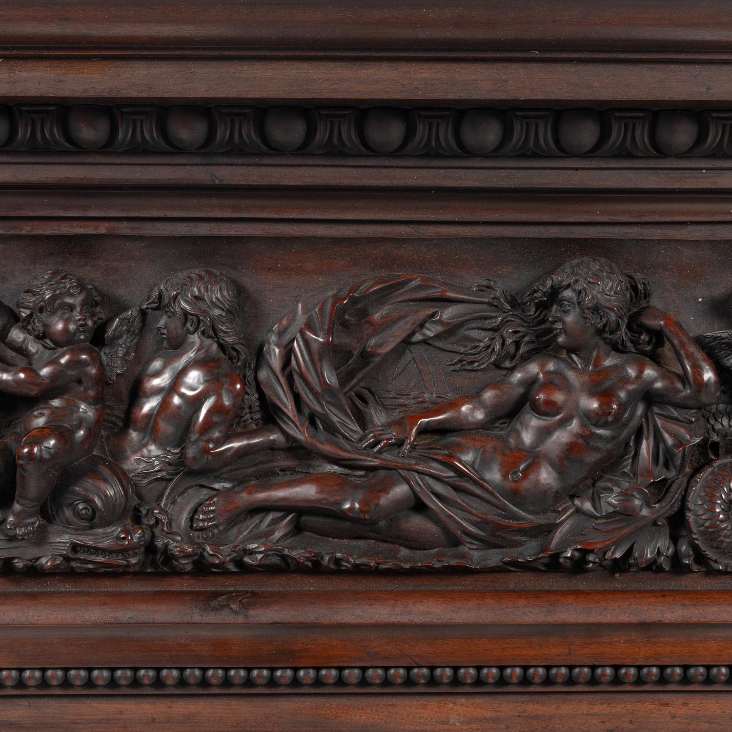 An Italian Carved Walnut Mantelpiece