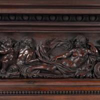 An Italian Carved Walnut Mantelpiece