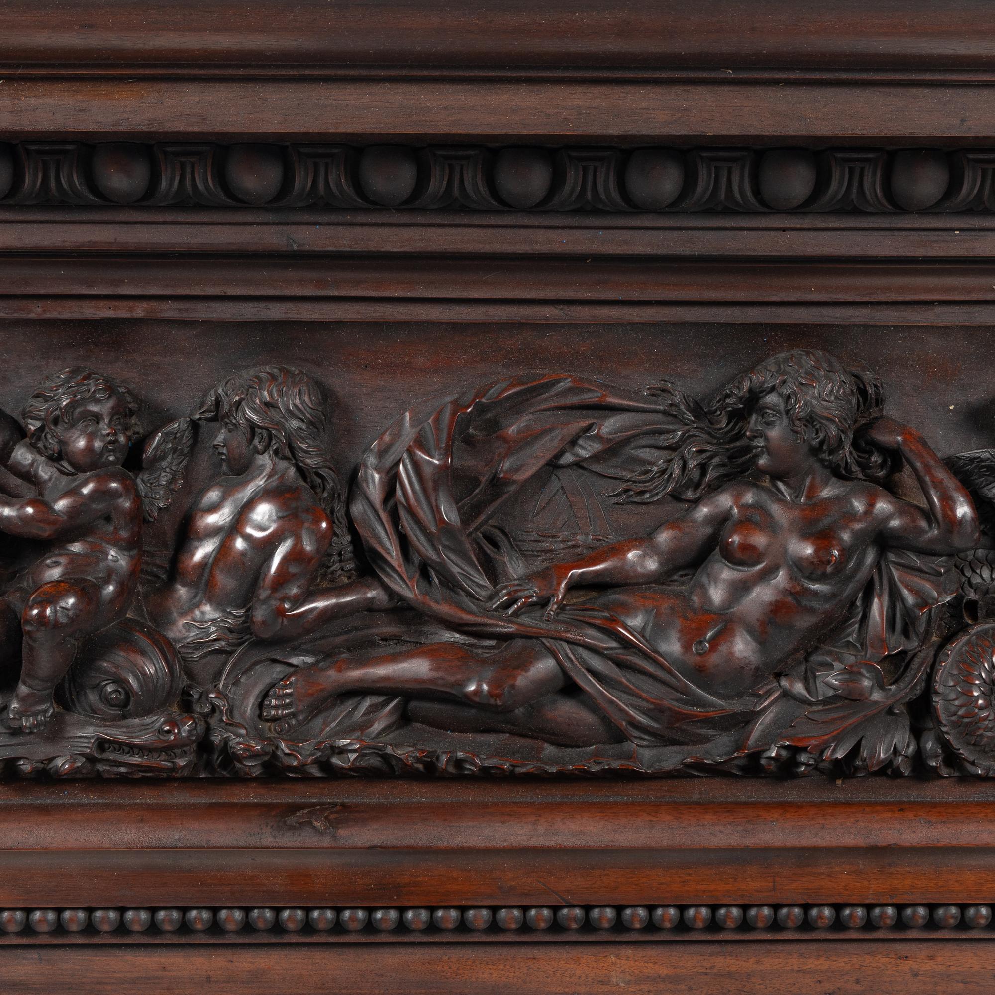 An Italian Carved Walnut Mantelpiece