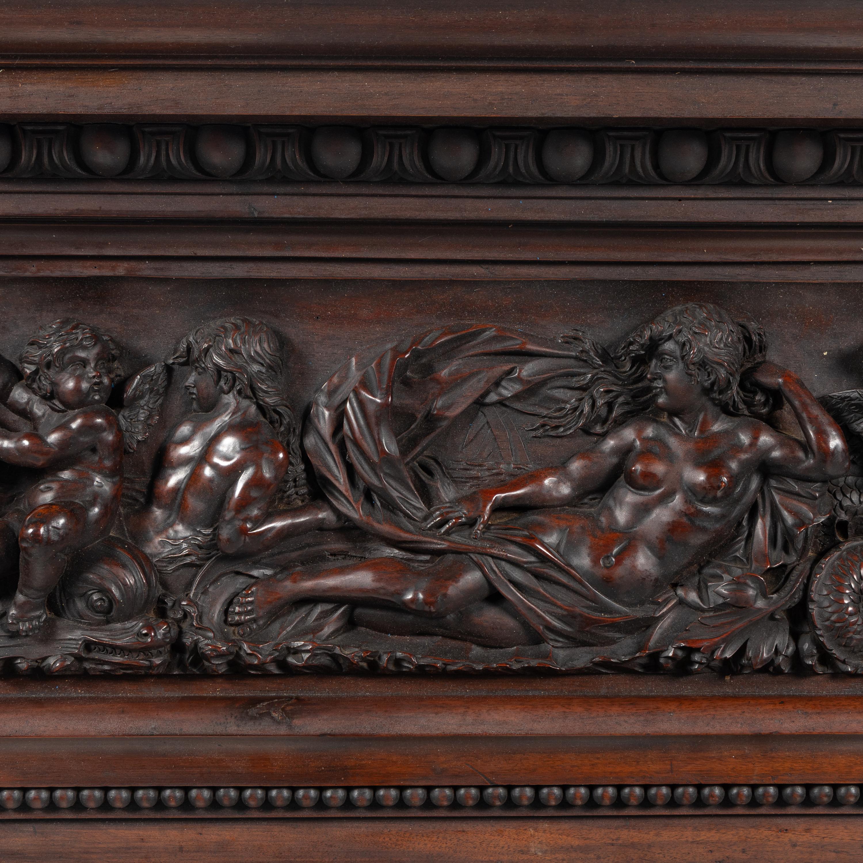 An Italian Carved Walnut Mantelpiece