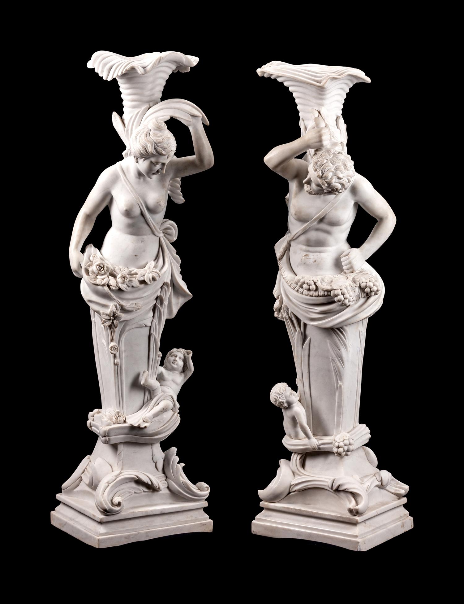 A Pair of Italian Marble Figural Torcheres