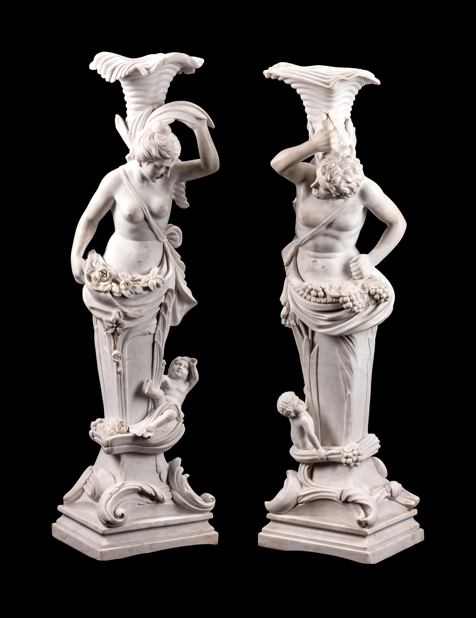 A Pair of Italian Marble Figural Torcheres