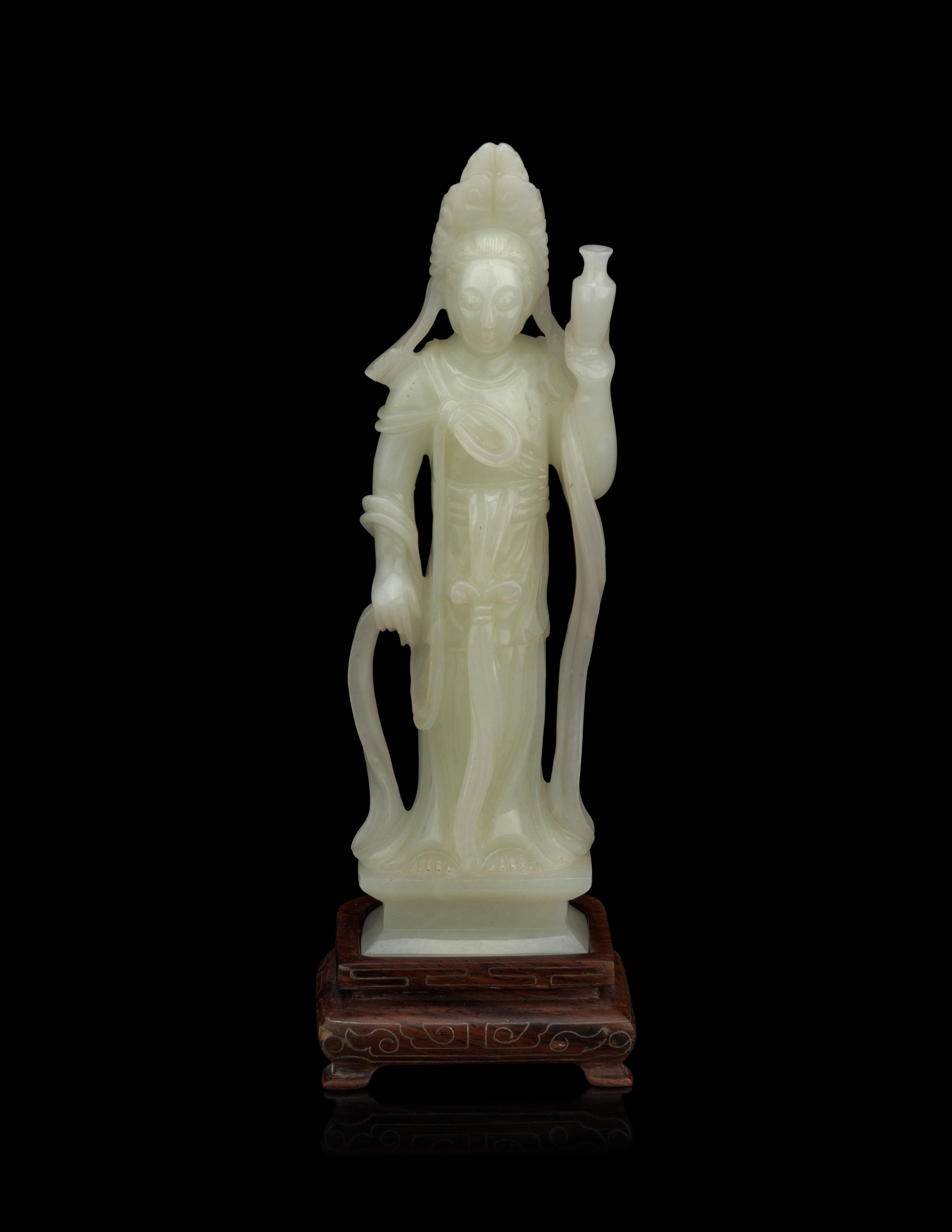 A Pale Celadon Jade Figure of Standing Guanyin