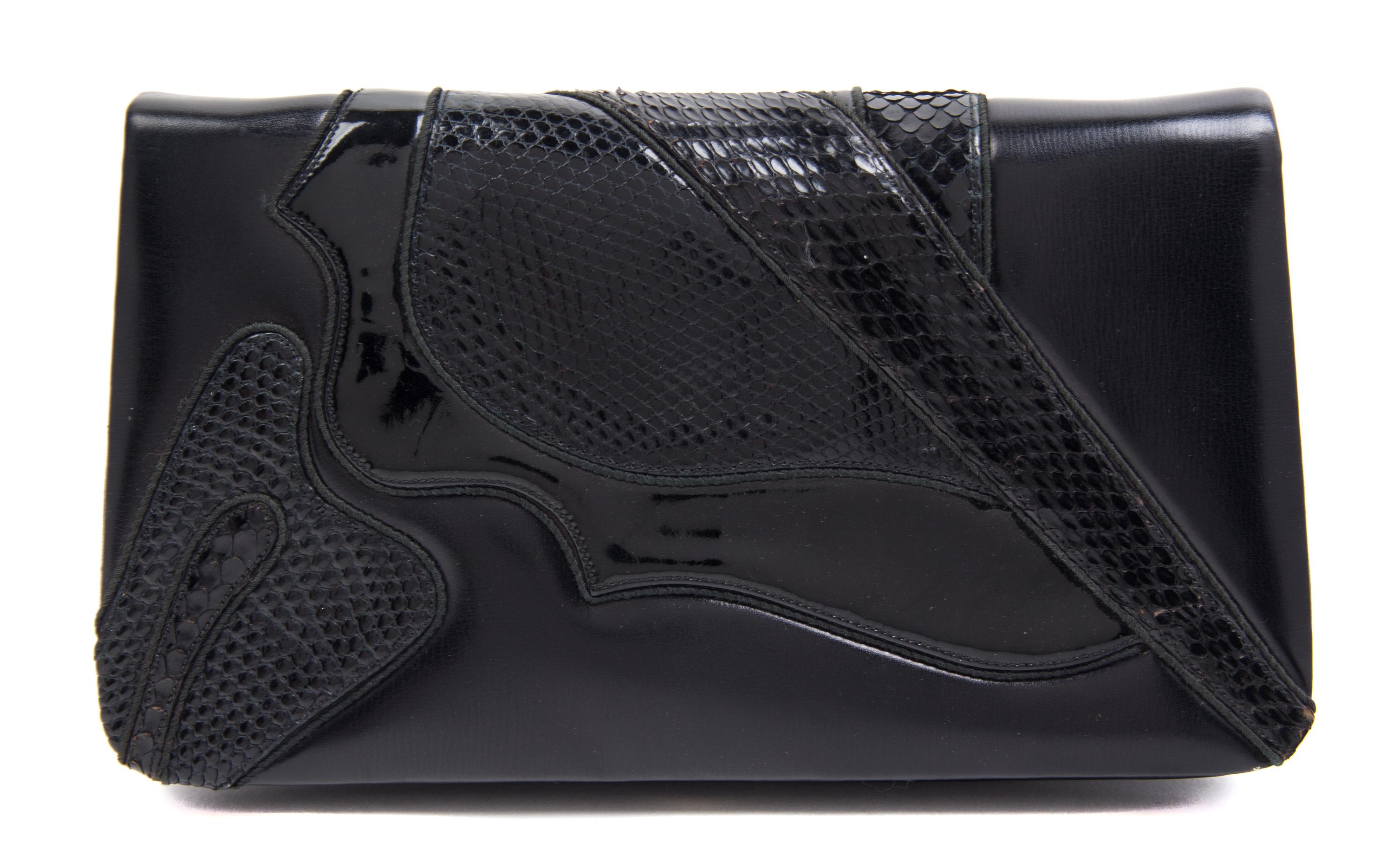 A Judith Leiber Black Leather Clutch, 8.5" x 5" x 1".