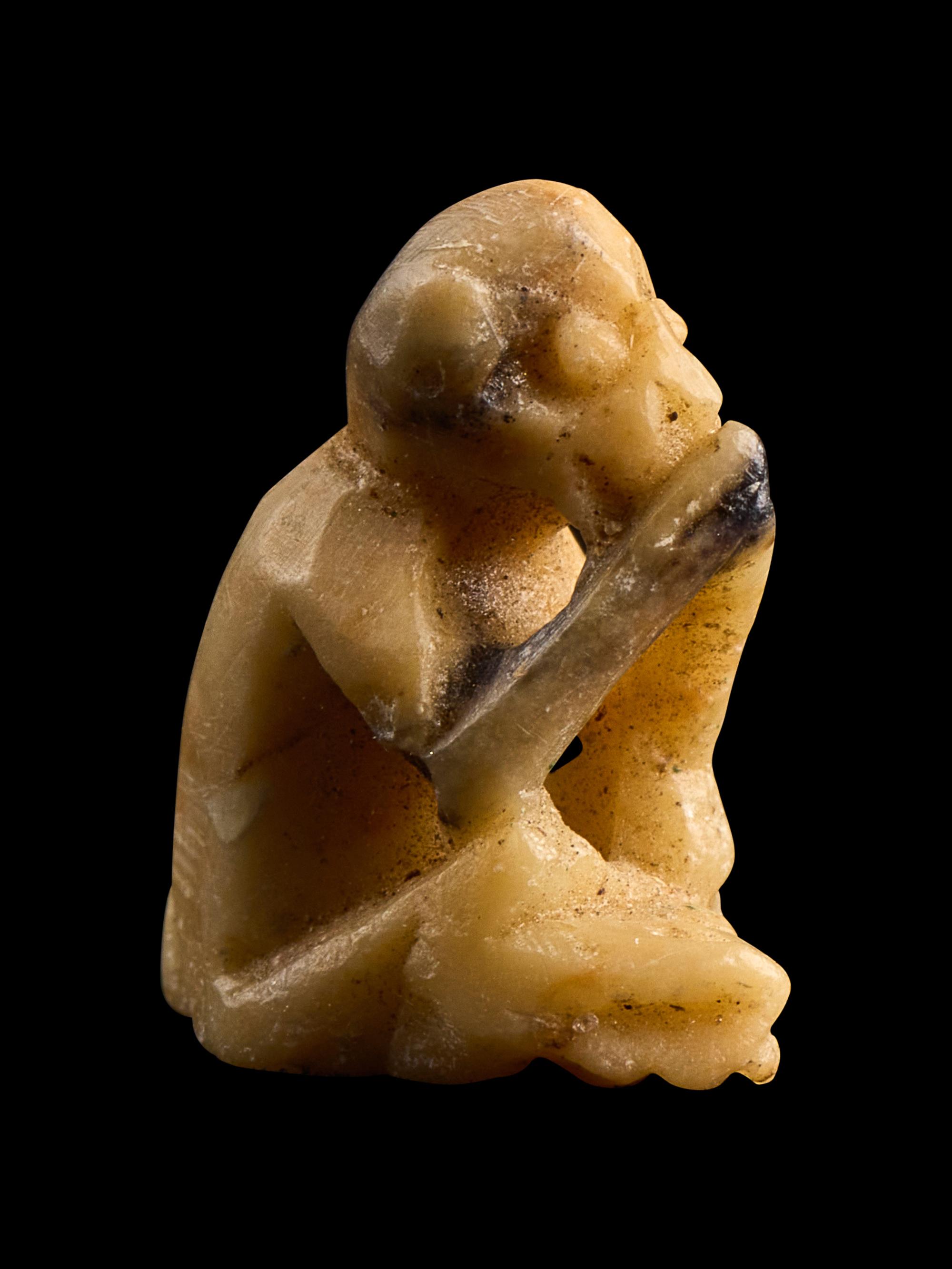 An Egyptian Carved Bone Monkey