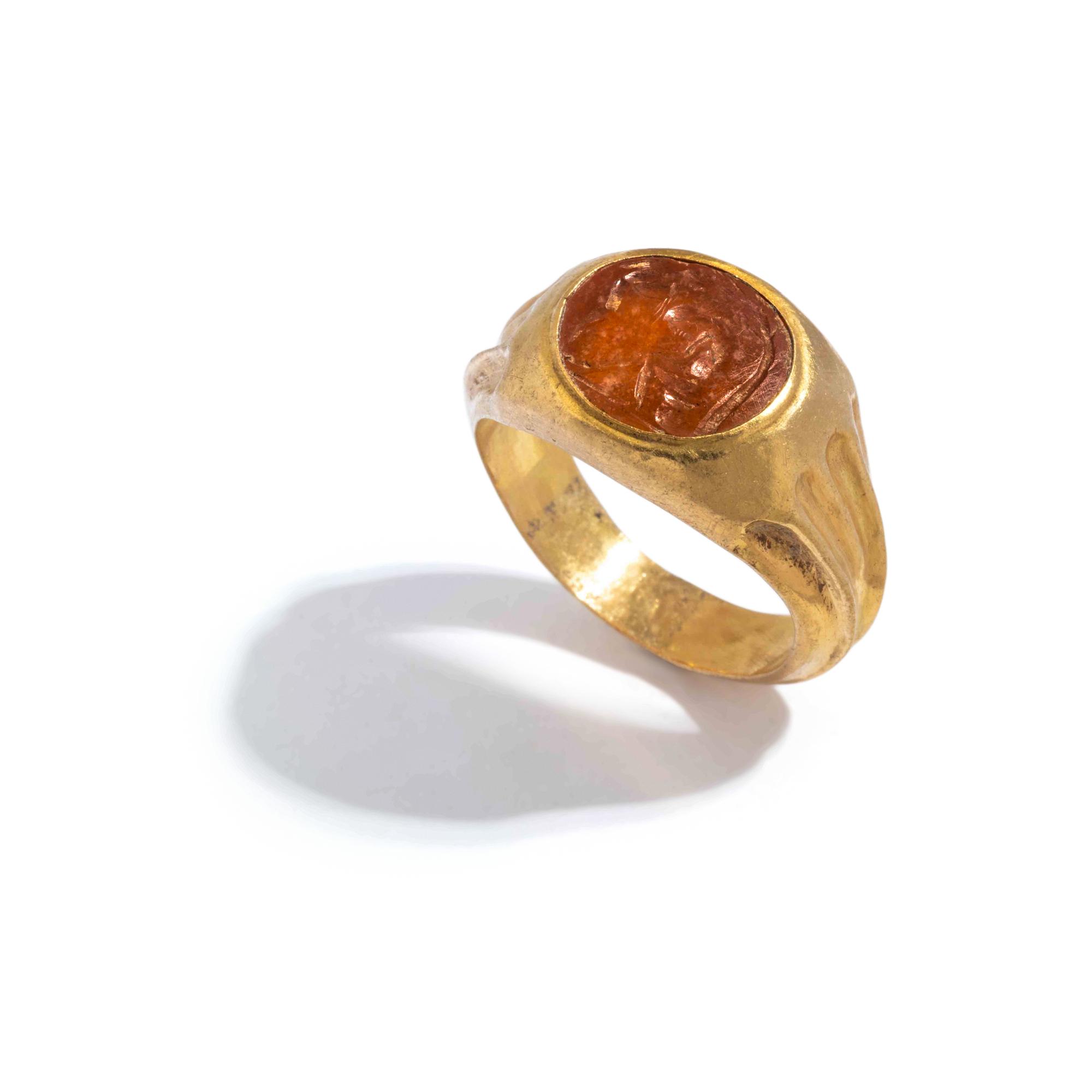 A Roman Gold and Citrine Finger Ring with Pysche and Eros
