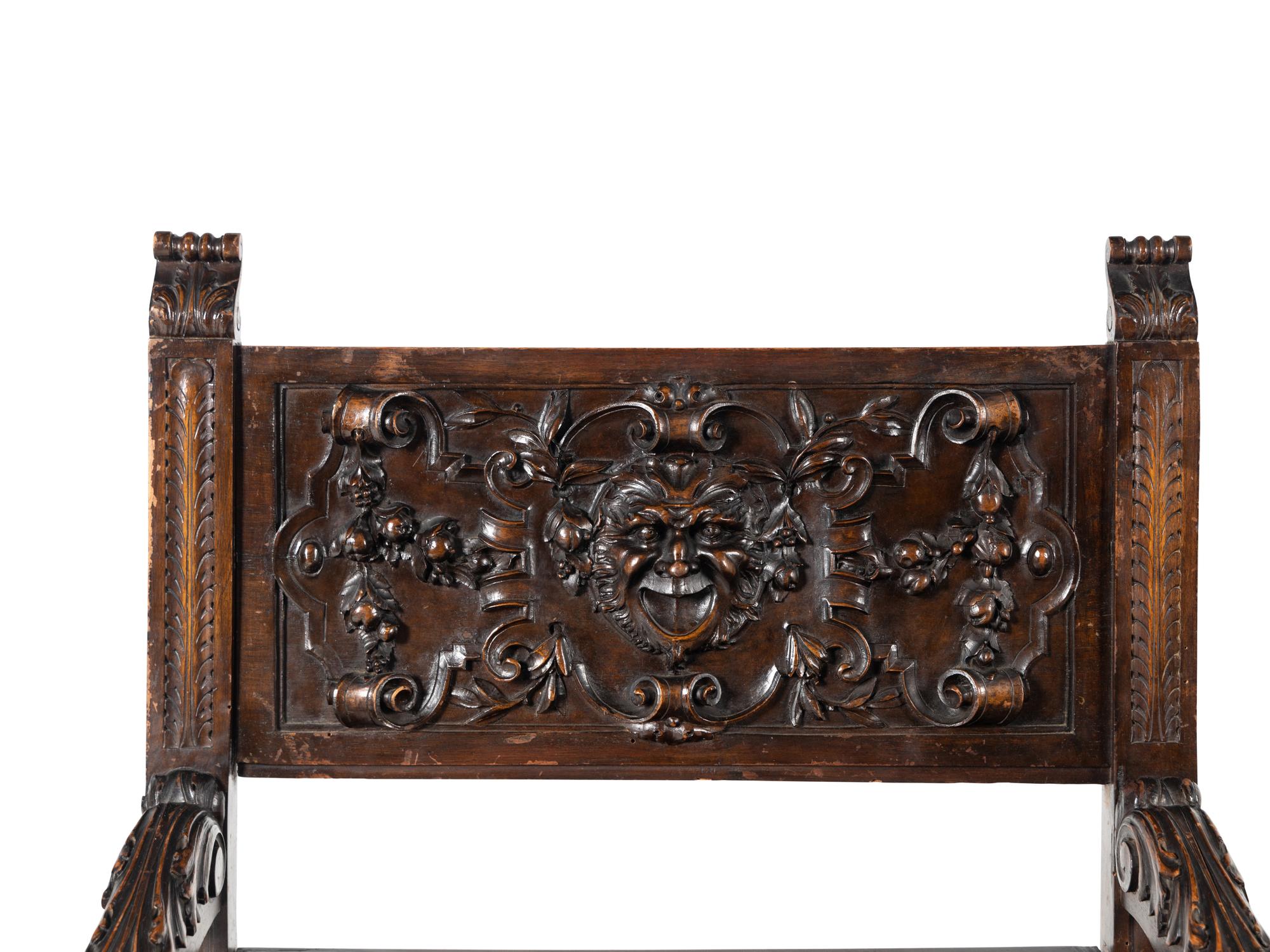 A Pair of Italian Renaissance Revival Carved Walnut Armchairs