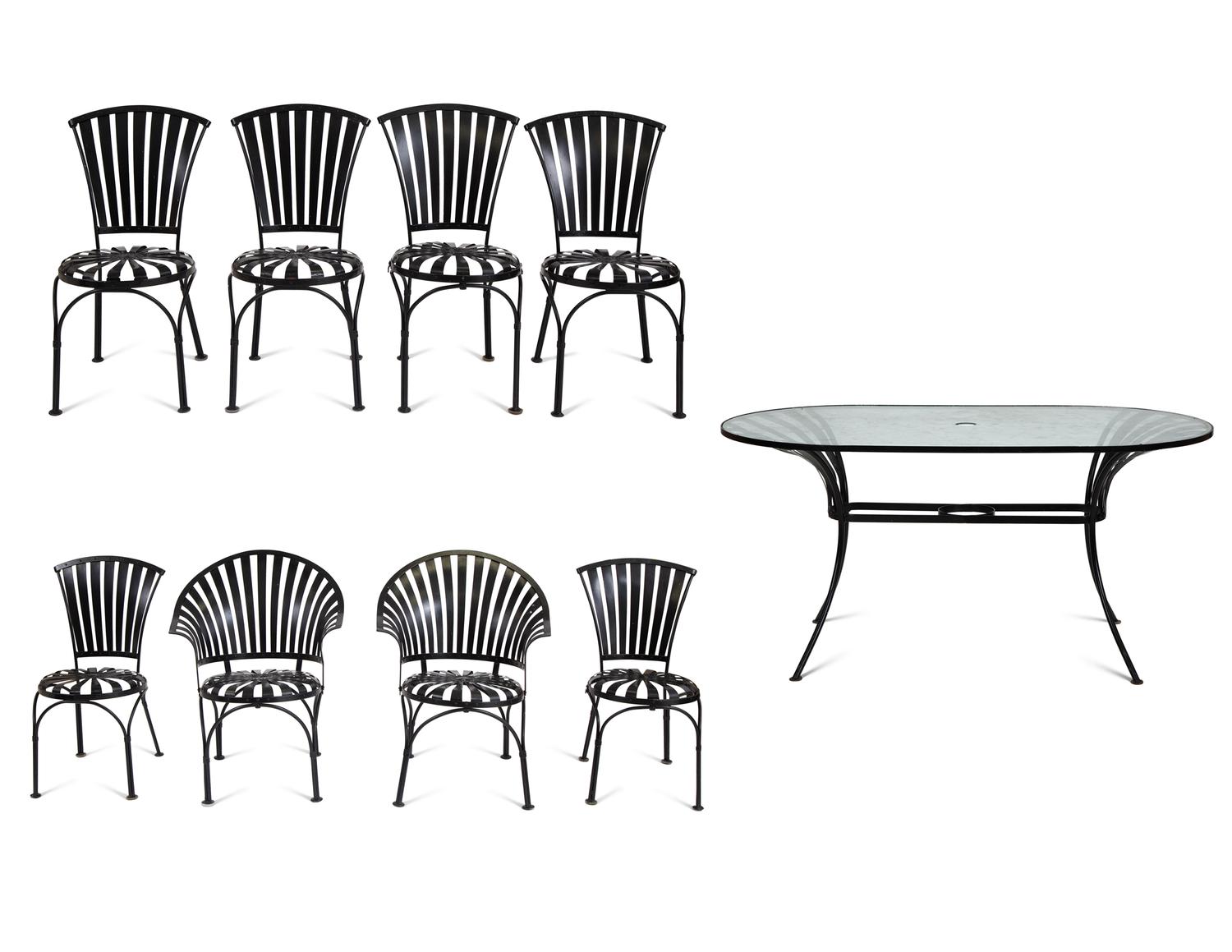 A Spring Steel Garden Table and Eight Chairs by Francois Carre
