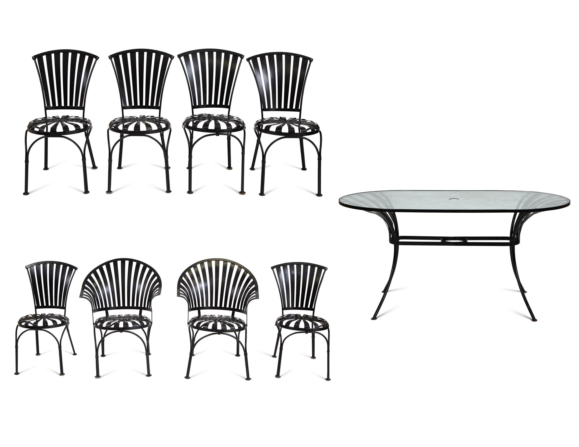A Spring Steel Garden Table and Eight Chairs by Francois Carre