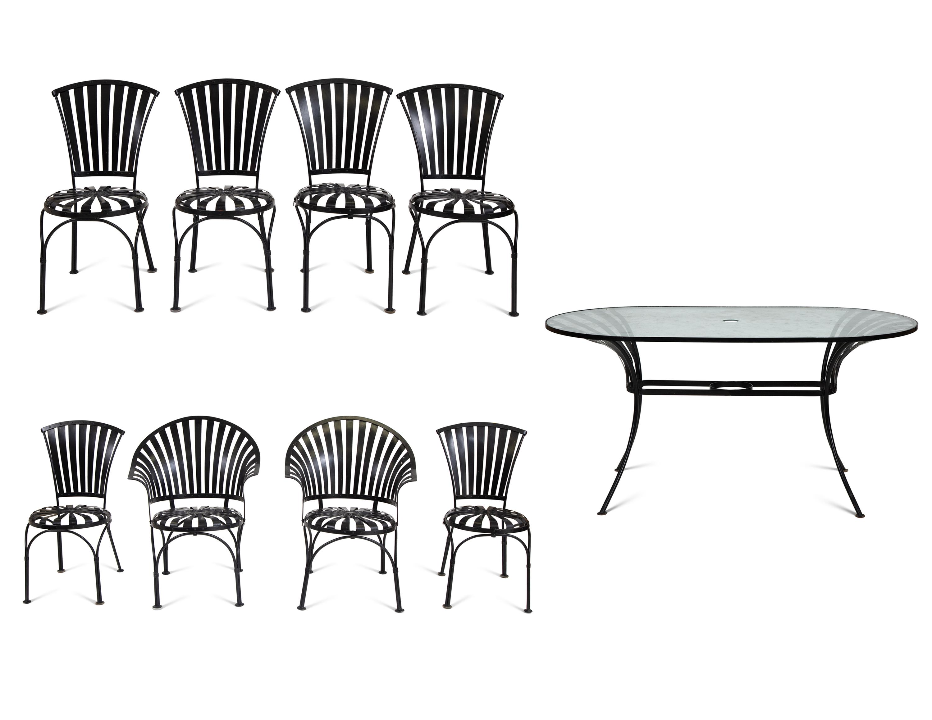 A Spring Steel Garden Table and Eight Chairs by Francois Carre