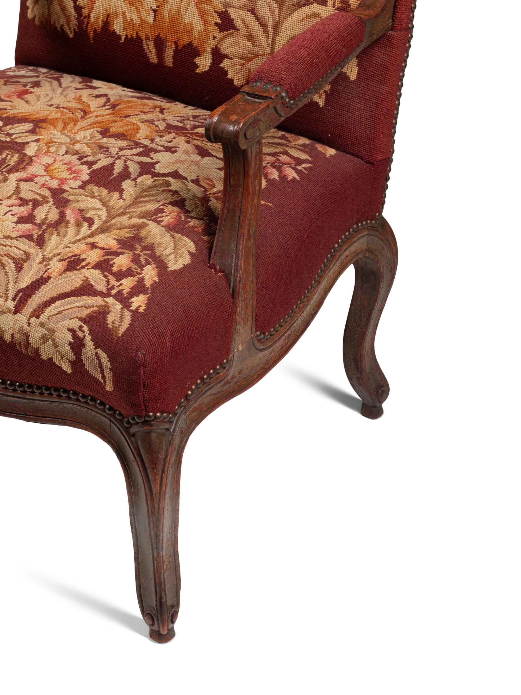 A Pair of Louis XV Walnut Fauteuils