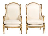 A Pair of Louis XVI Style Giltwood Wing Back Chairs Height 43 1/2 x width 26 1/2 x depth 24 inches. — 19TH CENTURY