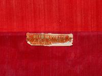 Two Chinese Red Ground Embroidered Silk 'Longevity' Panels