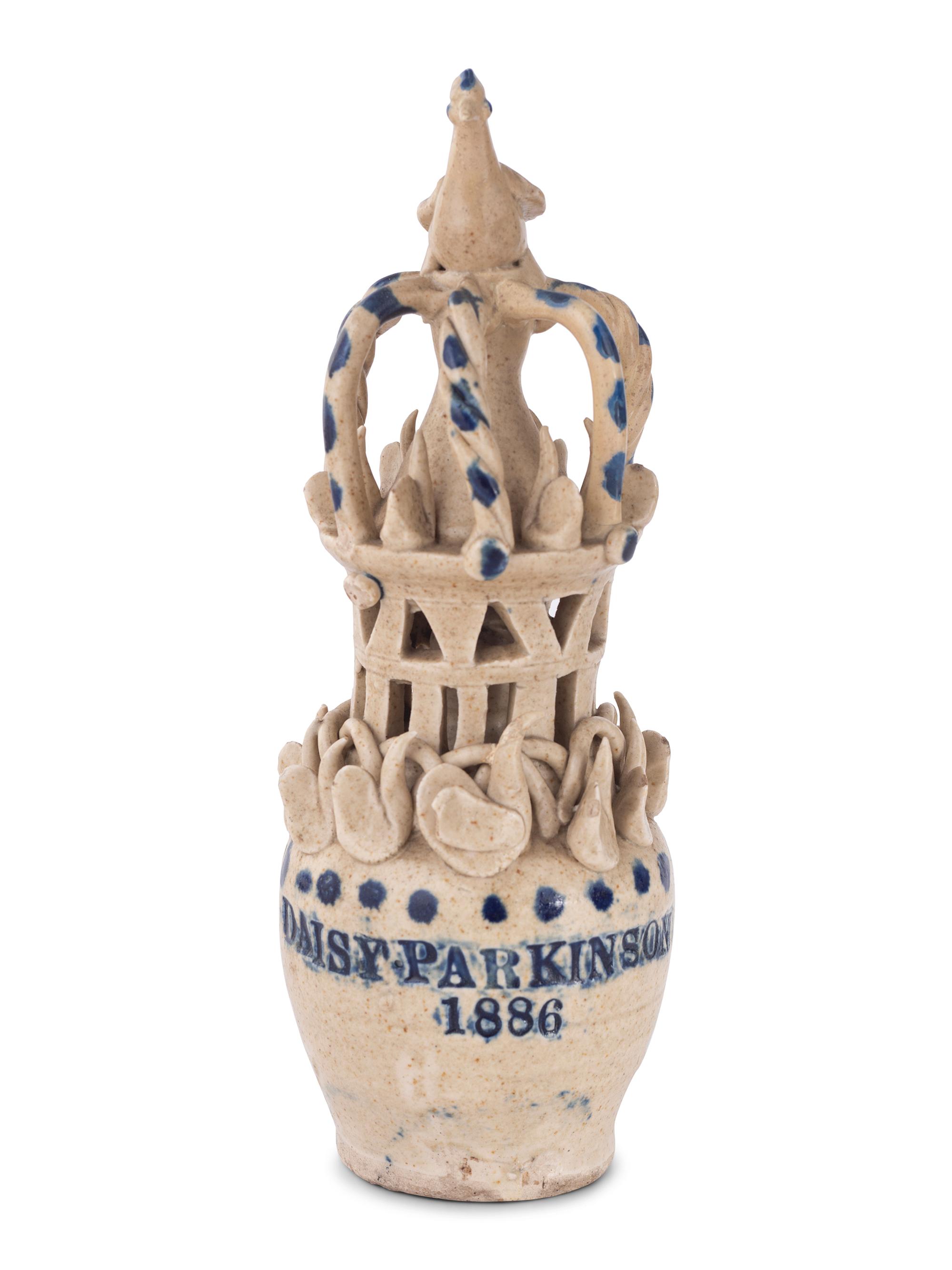 A Pair of Cobalt Decorated Stoneware Puzzle Banks
