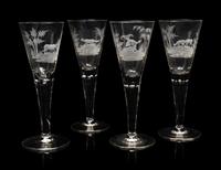 A Set of Four Large Etched Glass Wine Stems