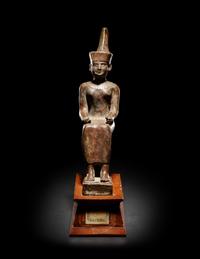 An Egyptian Gold Inlaid Bronze Seated Neith